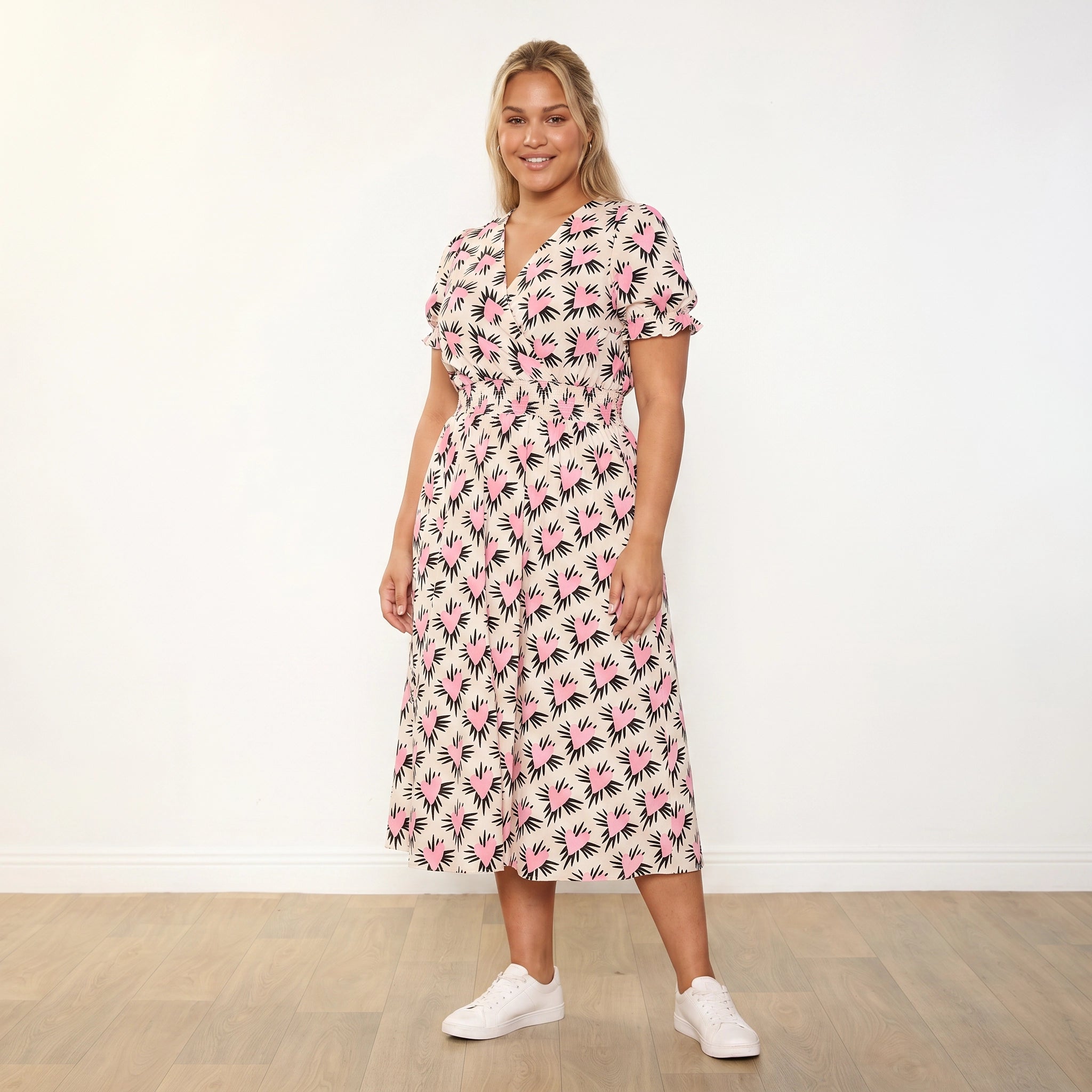 Belle Dress (Pink Heart) - Plus Size Model XXL, arms relaxed slight angle approachable expression