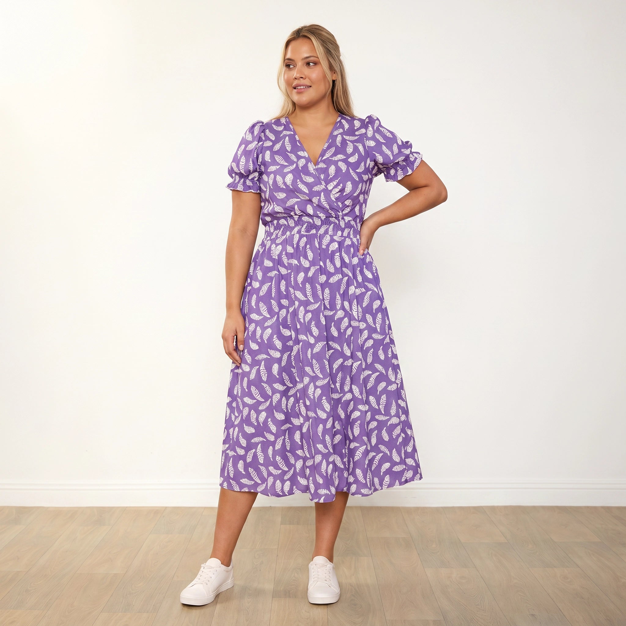 Belle Dress Violet Feather - Plus Size Model XXL, one hand on hip looking to side