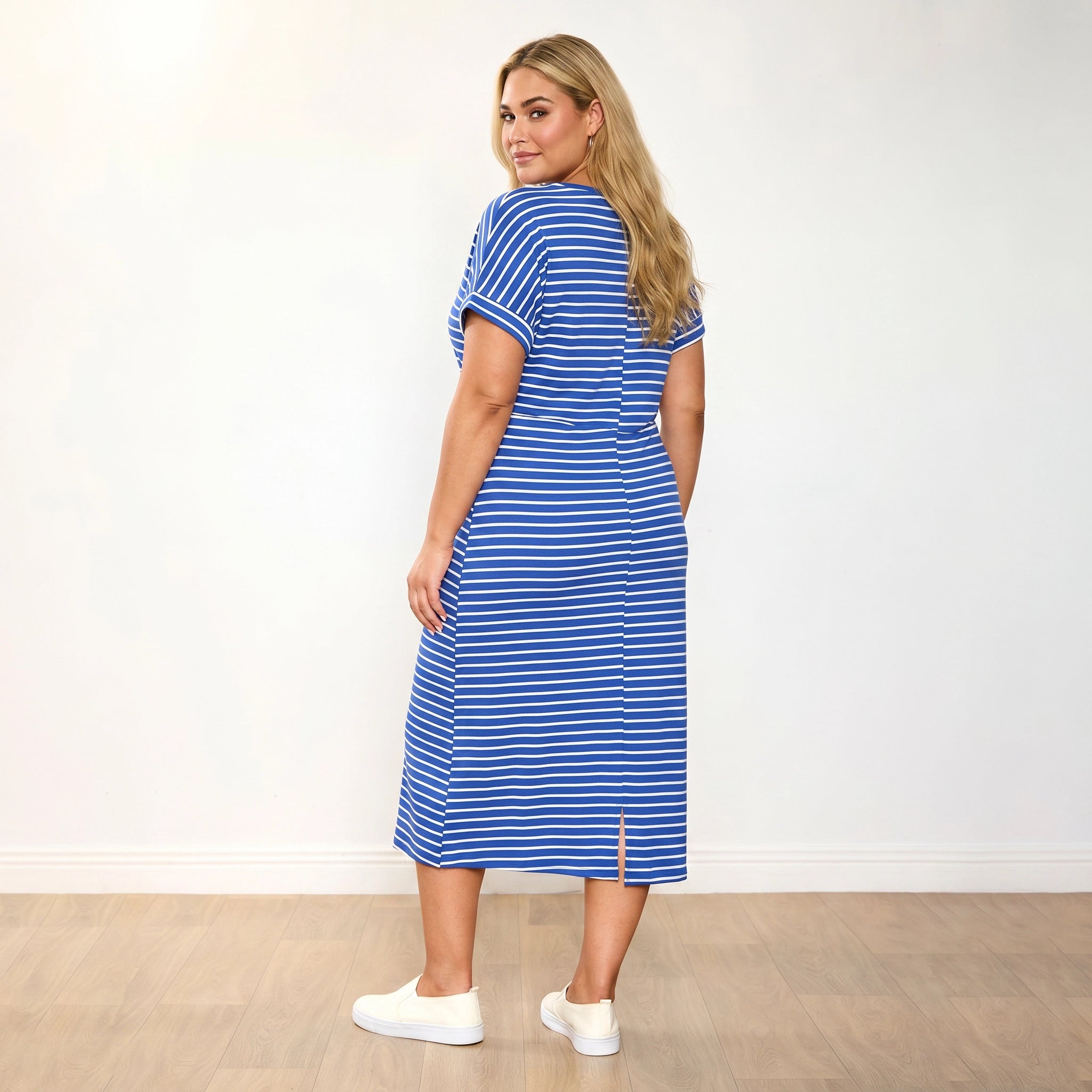 Muriel Dress (Cobalt Stripe) - Eliza plus size model, 3/4 back looking over shoulder
