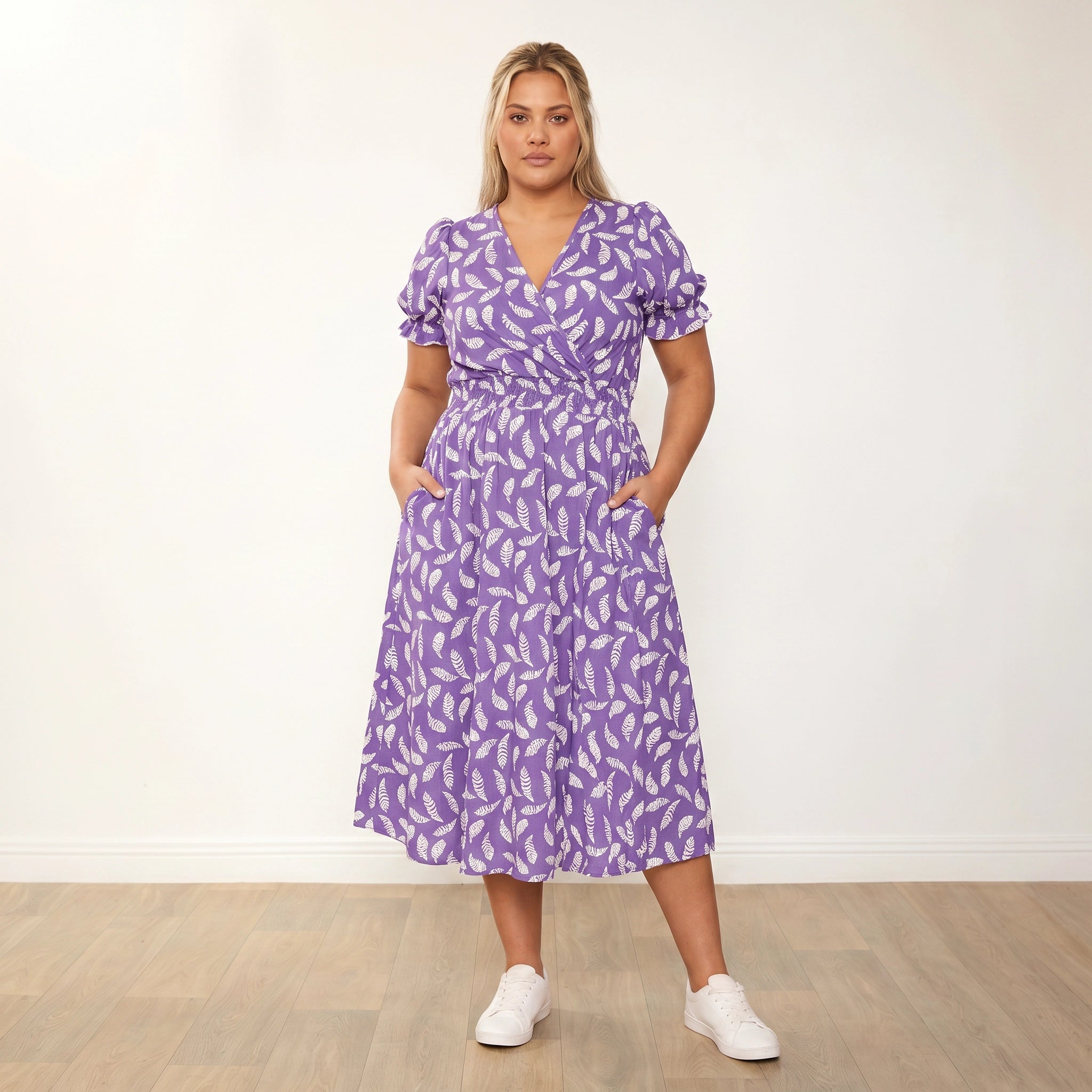 Belle Dress Violet Feather - Plus Size Model XXL, hands in pockets direct gaze
