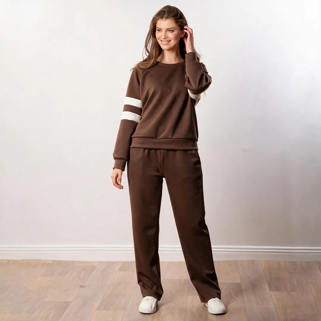 Model wearing the Jasmine Stripe Co-ord in brown, front view with contrast white sleeve stripes