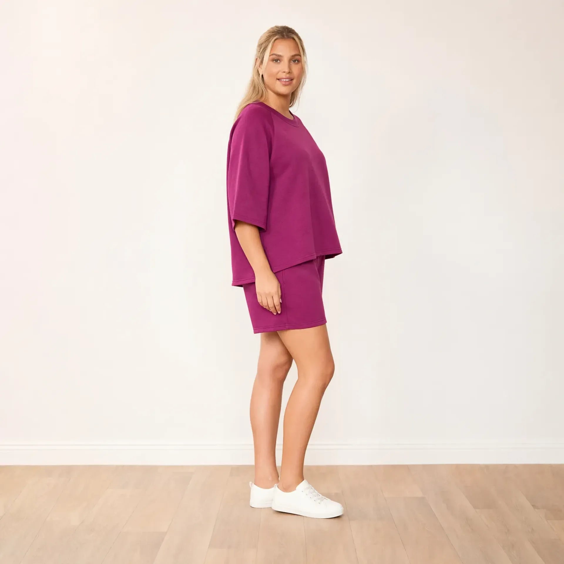 Suki Set Berry - side profile smiling, plus size model