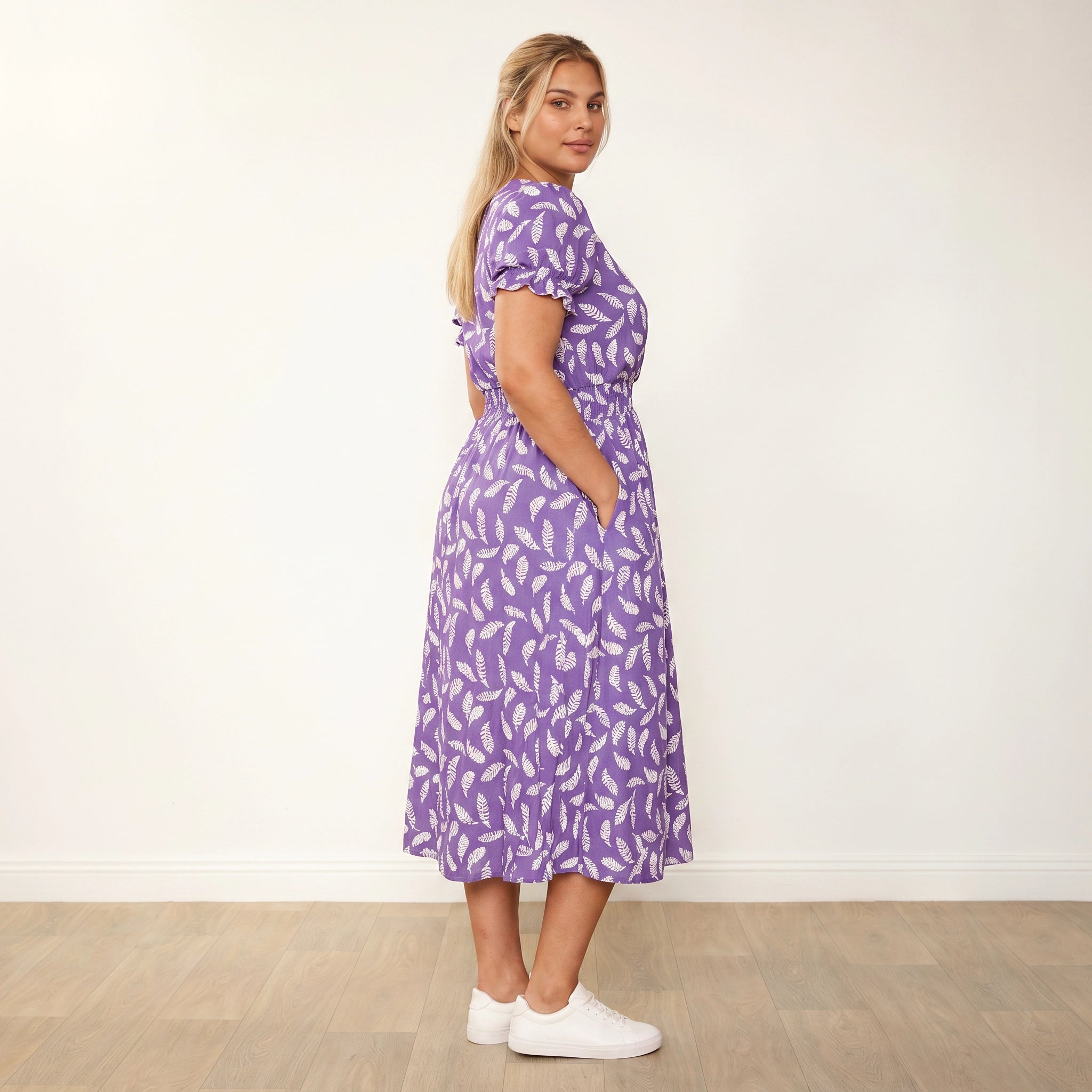 Belle Dress Violet Feather - Plus Size Model XXL, side profile looking over shoulder