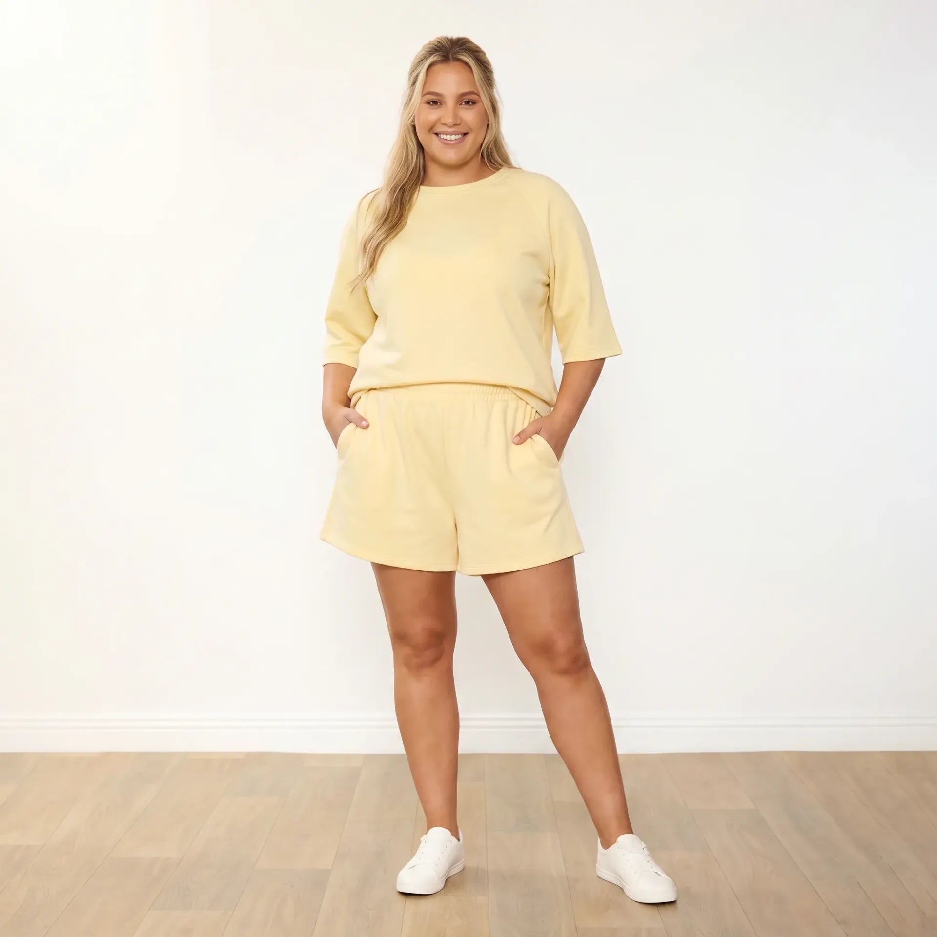 Suki Set Lemon - plus size model front view smiling hip shift