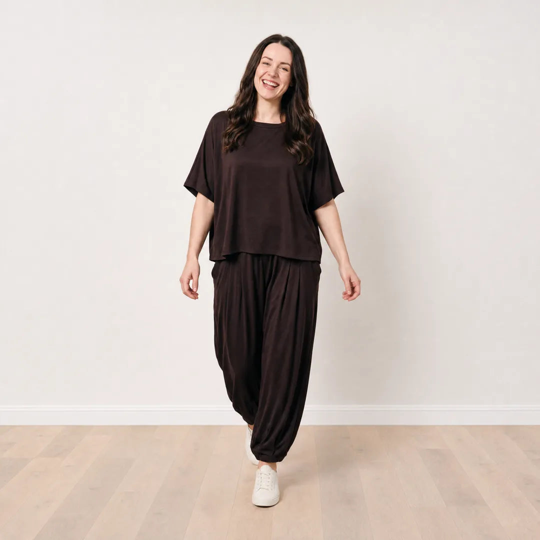 Róisín wearing the Orla Co-Ord in Chocolate Brown in a cheerful relaxed walking pose