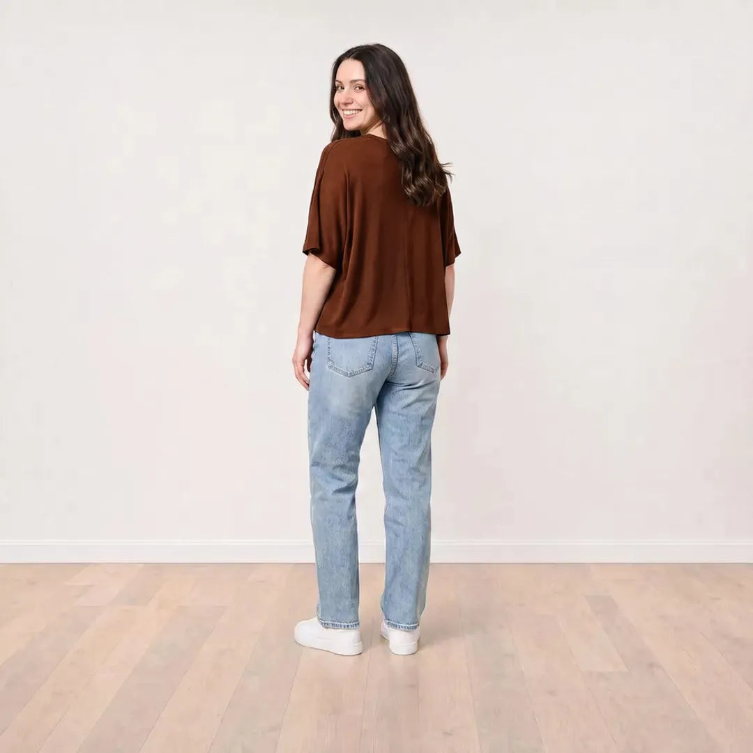 Orla Top in chocolate brown styled with light-wash straight-leg jeans, back view