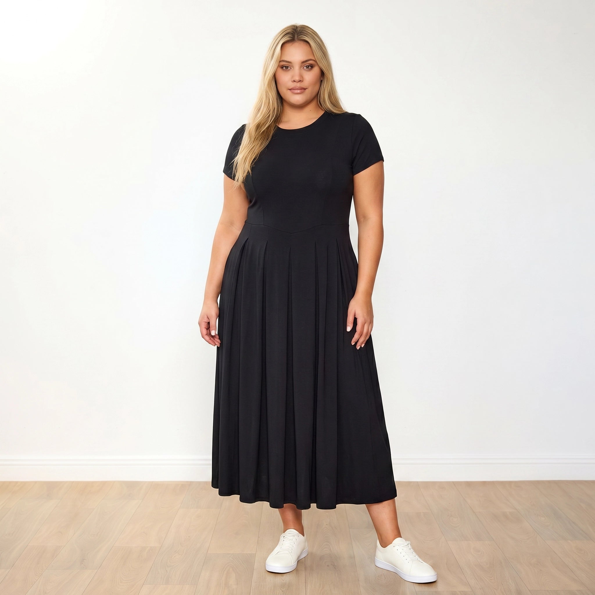Polly Dress Black - Plus Size Model XXL, side profile hands clasped