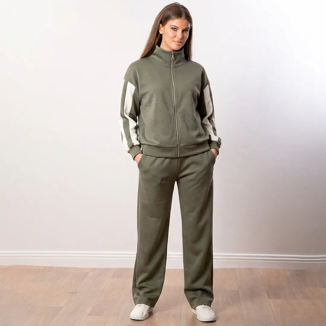 Aubree Co-ord in khaki green worn with jacket zipped high and hands in the trouser pockets