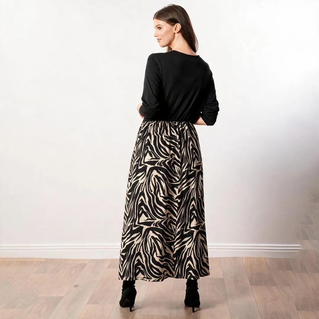 Audrey Dress in black and cream zebra print, back view showing full length of the gathered skirt