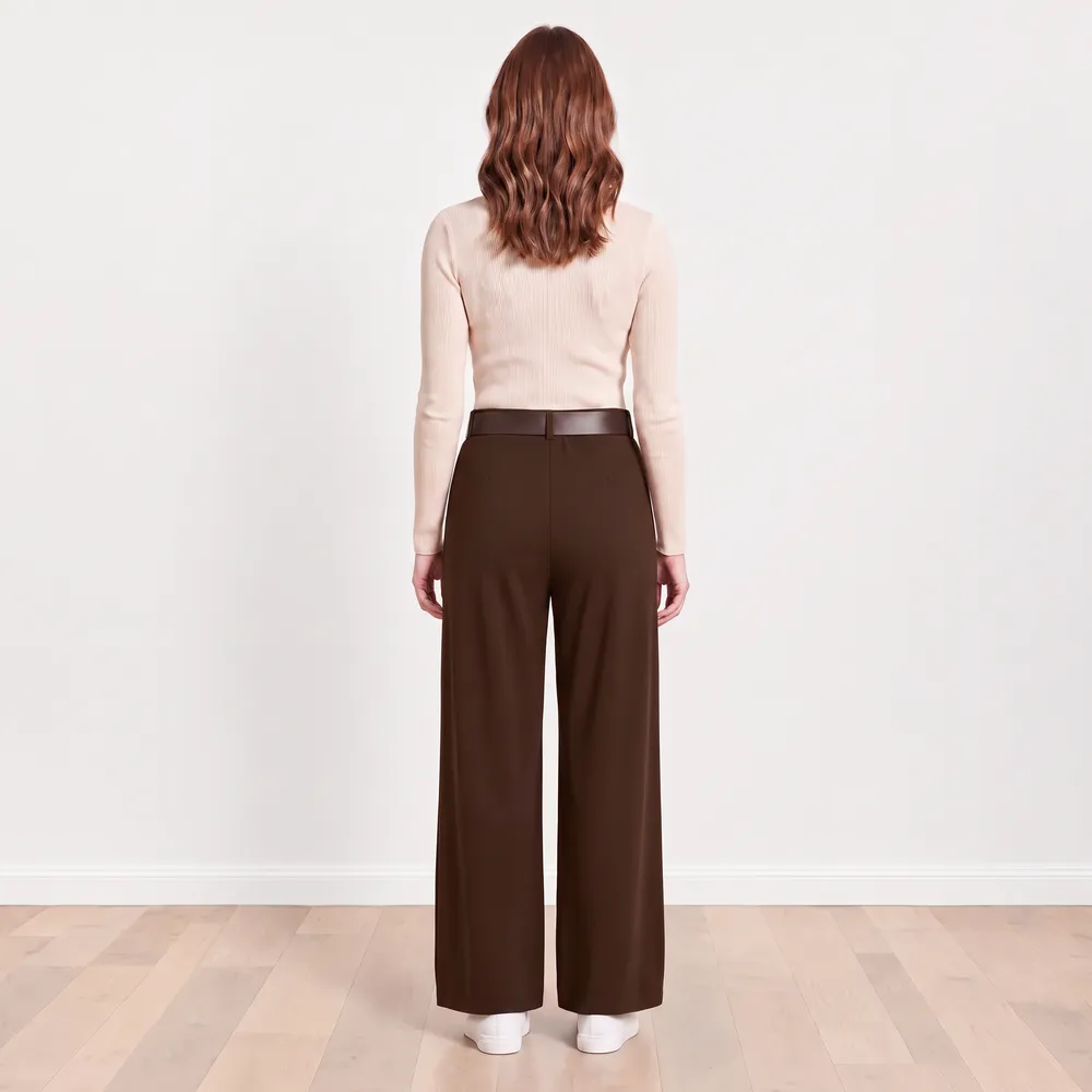 Ellana Trousers in brown — full back view showing rear seam detail, hem and white trainers