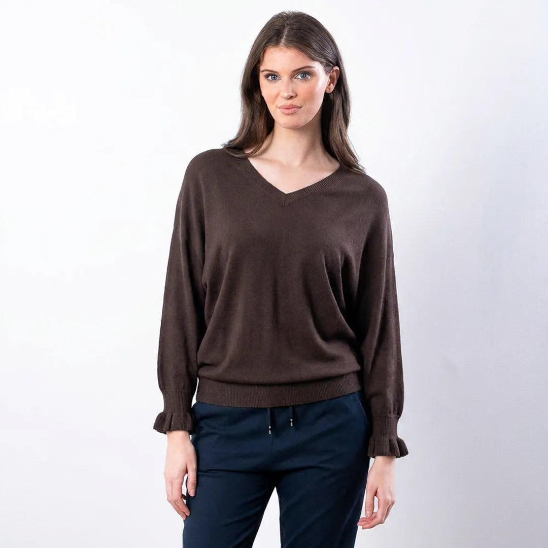 Chocolate brown Lexie batwing V-neck knit top with navy drawstring trousers, waist-up front view