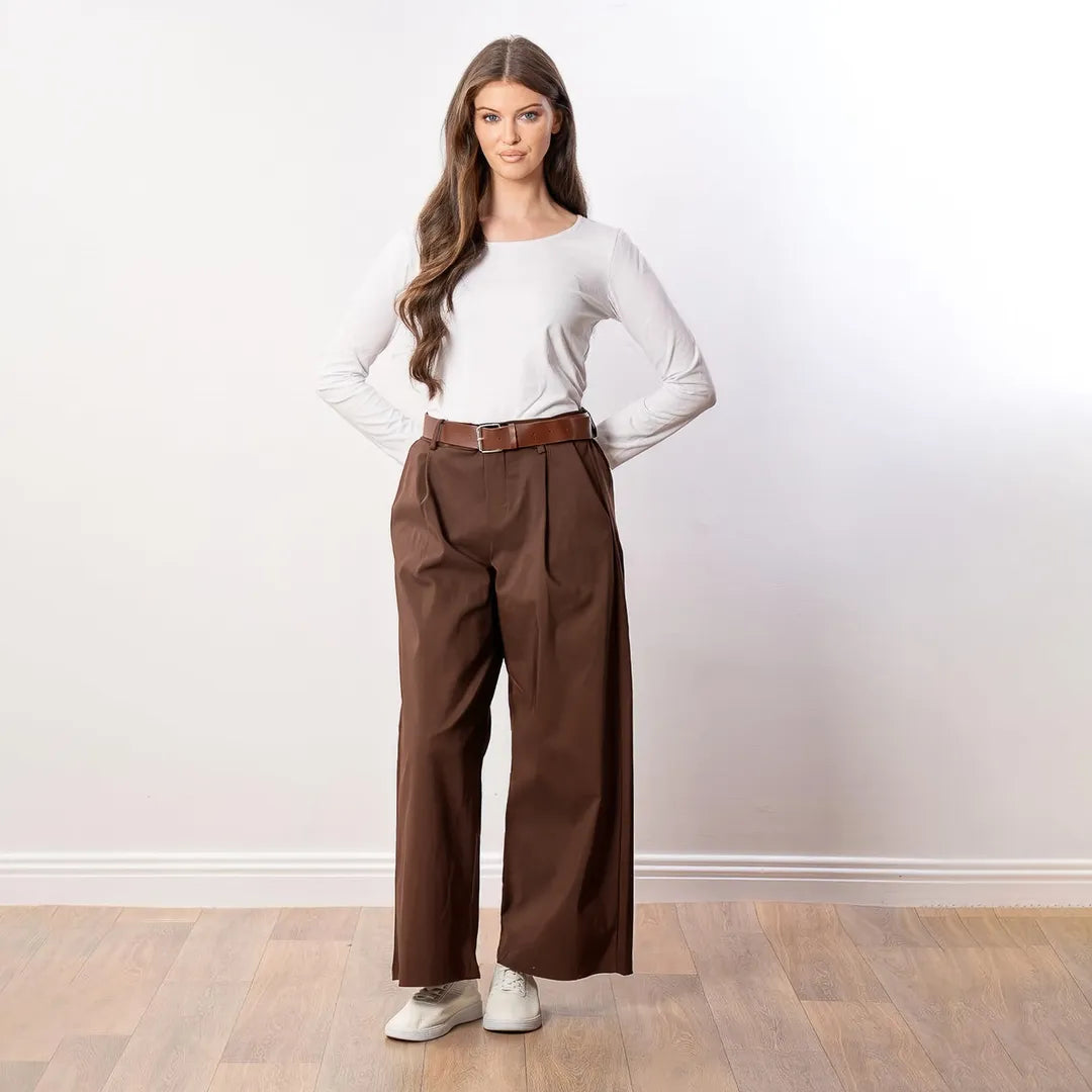 Nora Wide Leg Trousers in brown, relaxed front view with hands behind back