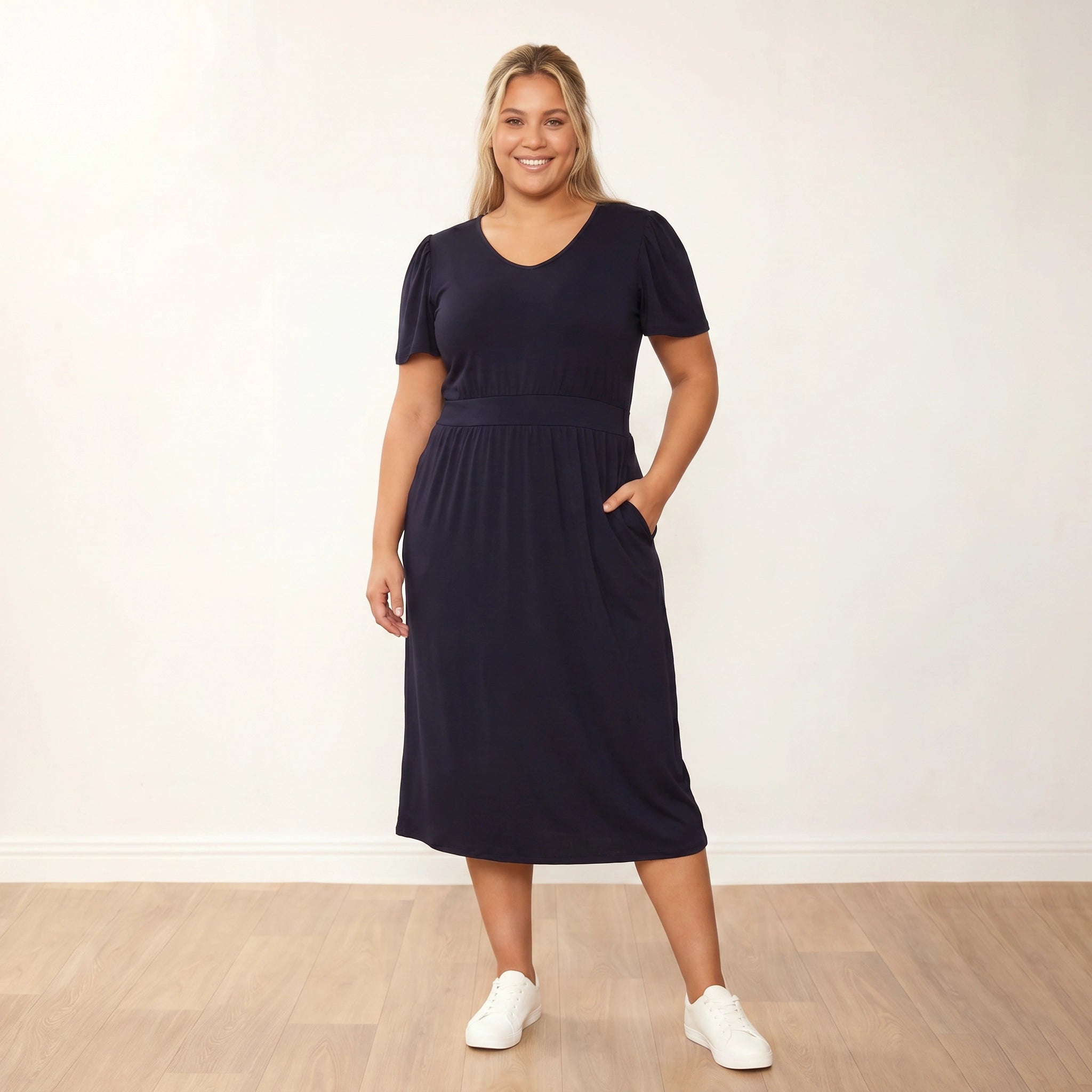 Lois Dress (Black) - Plus Size XXL - Front, one hand in pocket, smiling