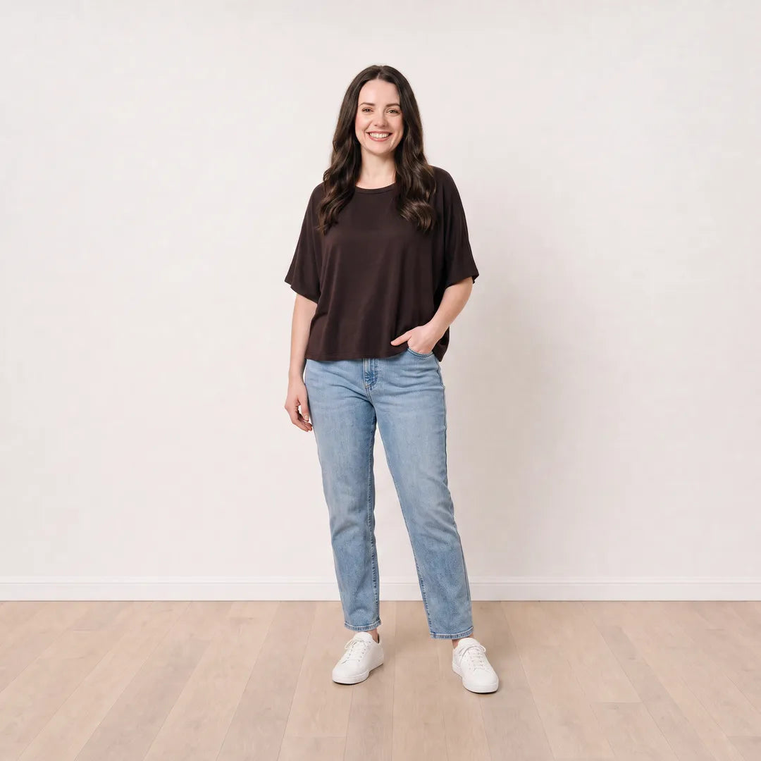 Orla Top in chocolate brown styled with light-wash straight-leg jeans, relaxed pocket pose