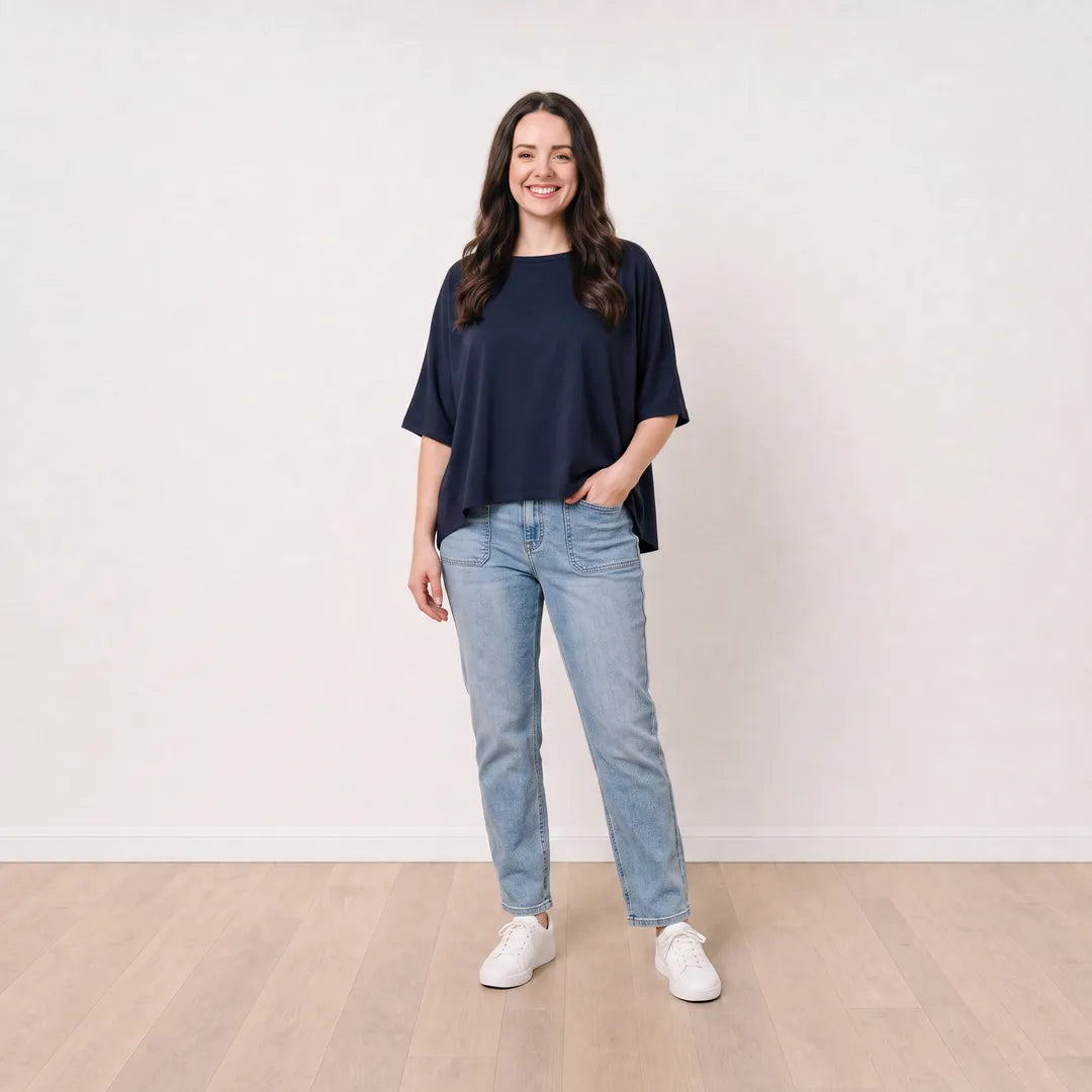 Orla Top in navy styled with light-wash straight-leg jeans — relaxed pocket pose